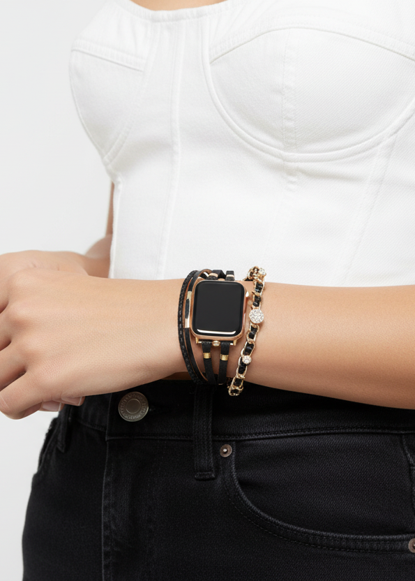 Person wearing a smartwatch and bracelets on a plain background